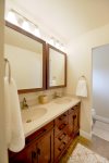 Master bathroom has double sinks, step-in shower and separate toilet room